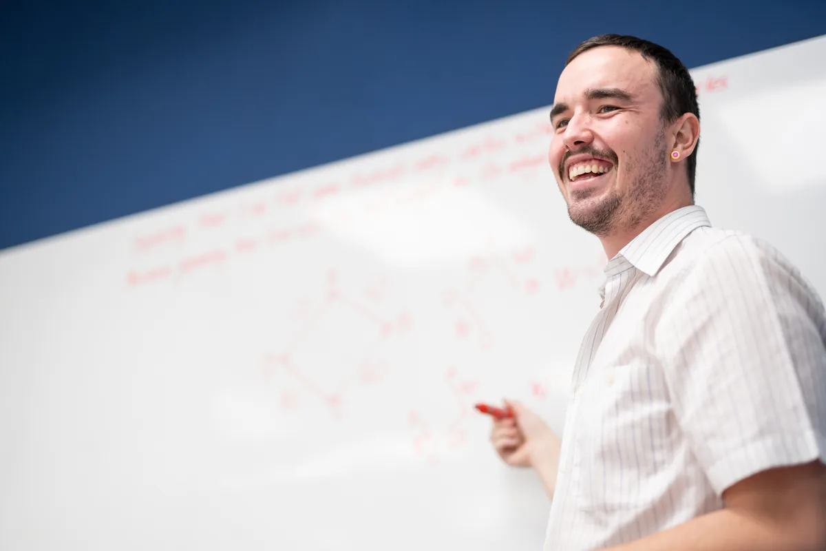 A Think Ahead tutor working with students